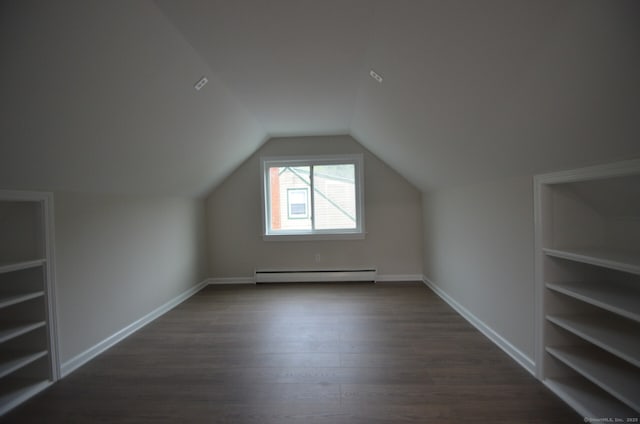 14 Harvest Ln, Bristol, CT 06010 - additional living space featuring baseboard heating, dark wood-type flooring, vaulted ceiling, and baseboards
