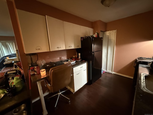 30 Woodland St Apt 5F, Hartford, CT 06105 - kitchen with freestanding refrigerator, white cabinets, an office area, and dark countertops