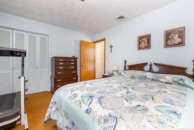 bedroom featuring a closet and carpet floors