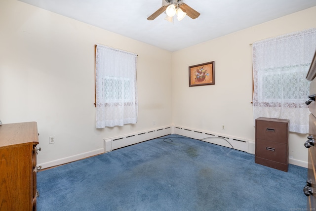 carpeted spare room featuring a ceiling fan, baseboards, and a baseboard heating unit