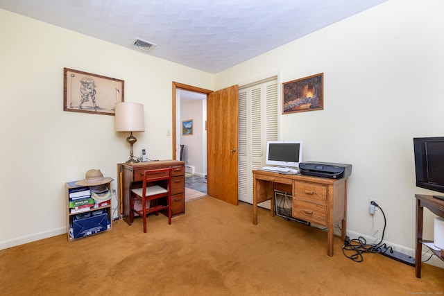 carpeted office with baseboards
