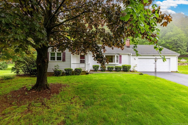 obstructed view of property with driveway, a garage, a chimney, and a front lawn