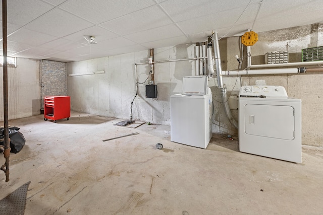 unfinished basement featuring independent washer and dryer and a paneled ceiling
