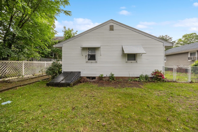 back of property featuring cooling unit
