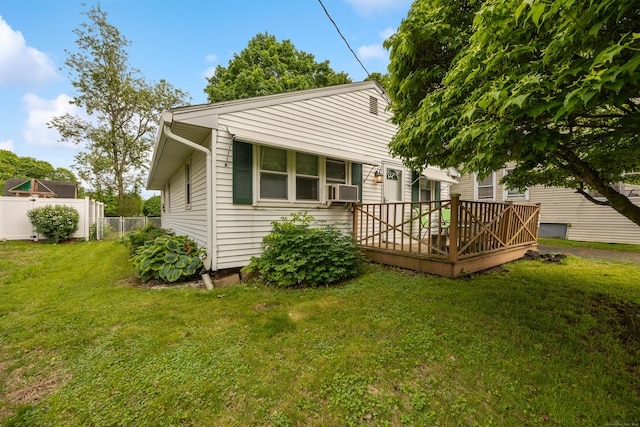 back of property featuring a wooden deck and cooling unit