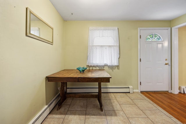 entrance foyer with baseboard heating and baseboards