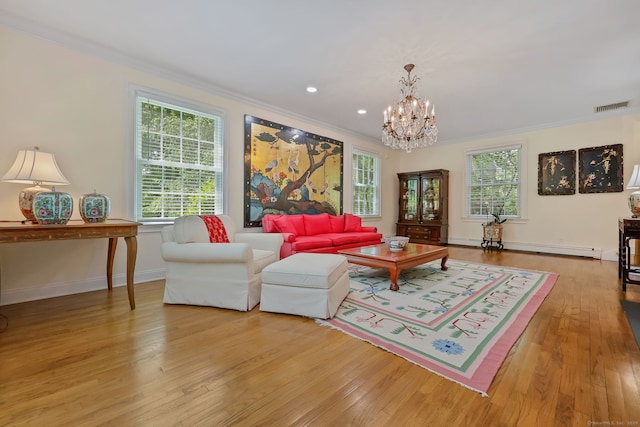 33 Carrington Dr, Stamford, CT 06831 - living area with crown molding, a chandelier, light wood-type flooring, a baseboard radiator, and recessed lighting