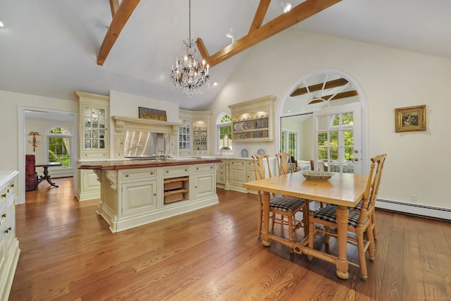 33 Carrington Dr, Stamford, CT 06831 - dining room with baseboard heating, beam ceiling, high vaulted ceiling, light wood-style floors, and a chandelier