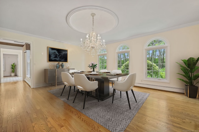 33 Carrington Dr, Stamford, CT 06831 - dining space featuring a baseboard heating unit, crown molding, light wood finished floors, and a chandelier