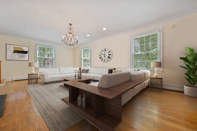 33 Carrington Dr, Stamford, CT 06831 - living area featuring ornamental molding, a baseboard radiator, light wood finished floors, a chandelier, and a baseboard heating unit
