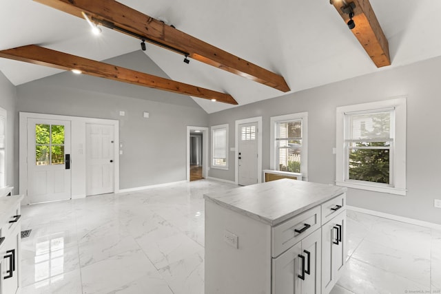182 Rte 66, Columbia, CT 06237 - kitchen with light marble finish flooring, open floor plan, baseboards, a kitchen island, and light countertops