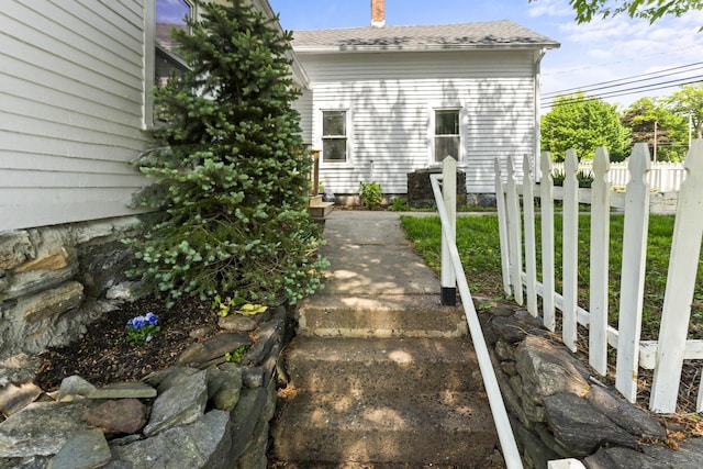 182 Rte 66, Columbia, CT 06237 - exterior space with fence, a chimney, and a shingled roof