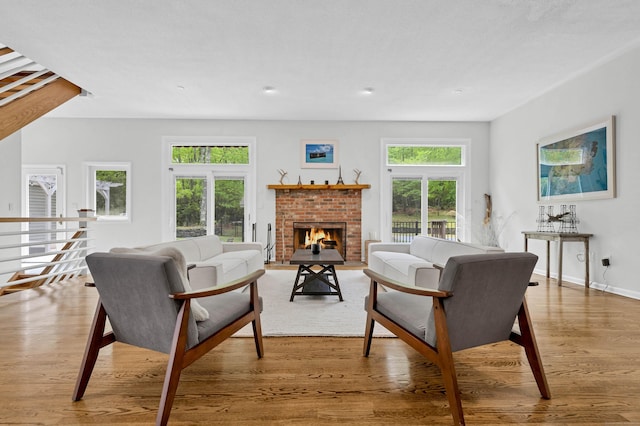 20A Bush Hill Dr, East Lyme, CT 06357 - living area with wood finished floors, a fireplace, baseboards, and recessed lighting