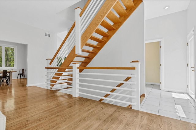 20A Bush Hill Dr, East Lyme, CT 06357 - entryway featuring wood finished floors, stairway, and baseboards