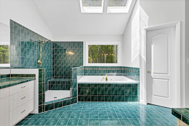 20A Bush Hill Dr, East Lyme, CT 06357 - bathroom with a garden tub, a tile shower, lofted ceiling, tile patterned floors, and vanity