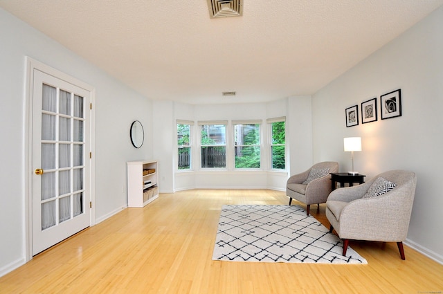15 Highland St Apt 106, West Hartford, CT 06119 - living area with wood finished floors and baseboards