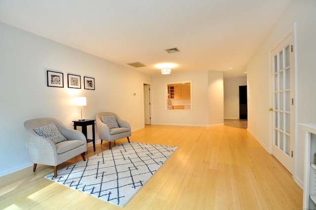 15 Highland St Apt 106, West Hartford, CT 06119 - sitting room with light wood-style floors and baseboards