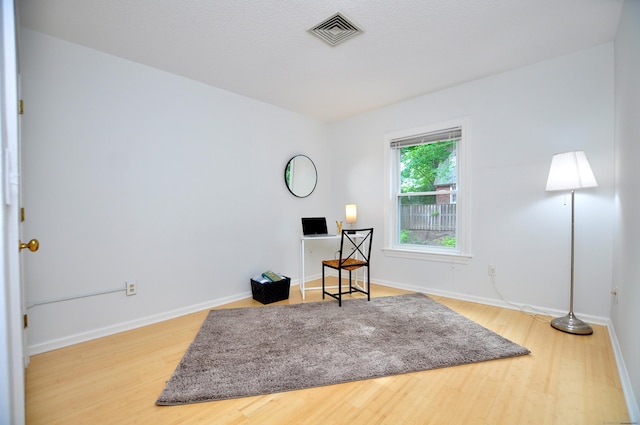 15 Highland St Apt 106, West Hartford, CT 06119 - sitting room featuring wood finished floors and baseboards