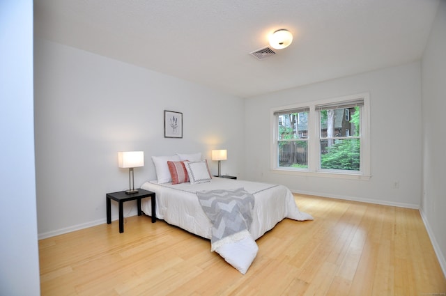 15 Highland St Apt 106, West Hartford, CT 06119 - bedroom featuring light wood-style flooring and baseboards