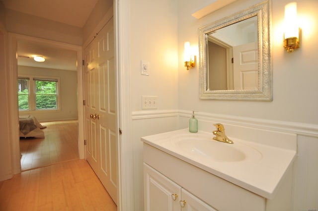 15 Highland St Apt 106, West Hartford, CT 06119 - bathroom featuring vanity and wood finished floors