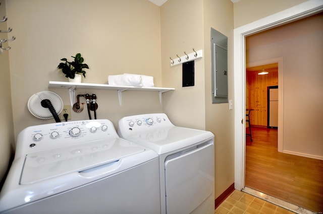 15 Highland St Apt 106, West Hartford, CT 06119 - laundry area featuring electric panel, washing machine and clothes dryer, and baseboards