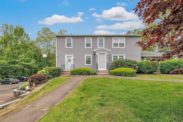 view of front of property with a front lawn