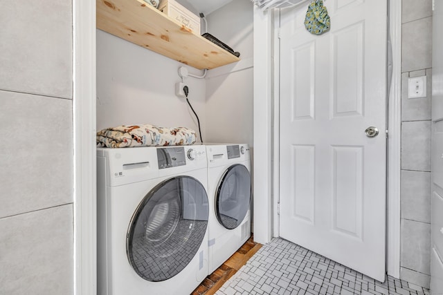 washroom with washer and clothes dryer