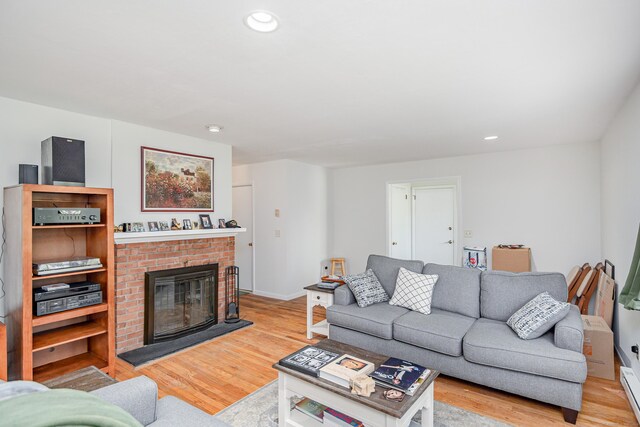 3 Lambert Ln Unit 3, Brookfield, CT 06804 - living area featuring wood finished floors, a brick fireplace, recessed lighting, a baseboard radiator, and baseboards