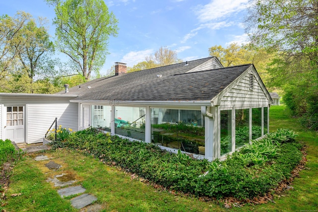 3 Lambert Ln Unit 3, Brookfield, CT 06804 - back of property featuring a chimney, a sunroom, and roof with shingles