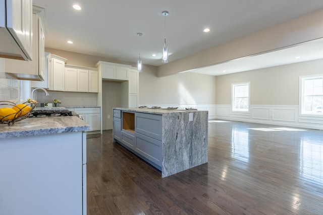2 Stratton Farms Rd, Suffield, CT 06093 - kitchen with a wainscoted wall, light stone countertops, dark wood-style flooring, white cabinetry, and recessed lighting