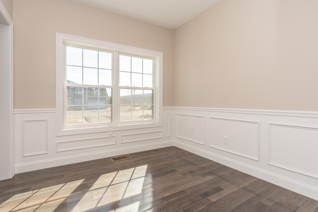 2 Stratton Farms Rd, Suffield, CT 06093 - spare room with a wainscoted wall, dark wood-style floors, and a decorative wall