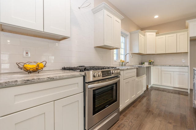 2 Stratton Farms Rd, Suffield, CT 06093 - kitchen with gas stove, dark wood-style flooring, white cabinets, tasteful backsplash, and light stone countertops