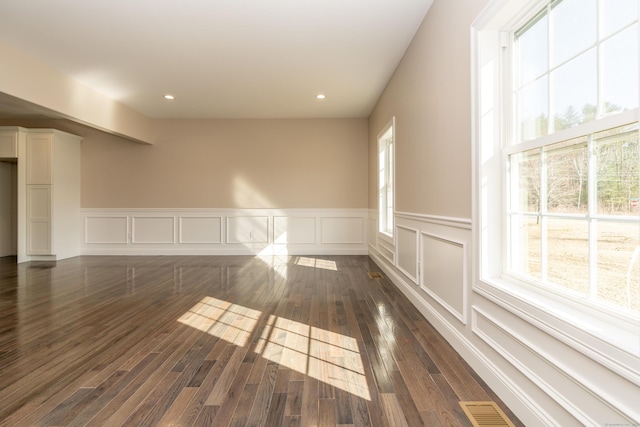 2 Stratton Farms Rd, Suffield, CT 06093 - spare room with wainscoting, dark wood finished floors, a decorative wall, and recessed lighting