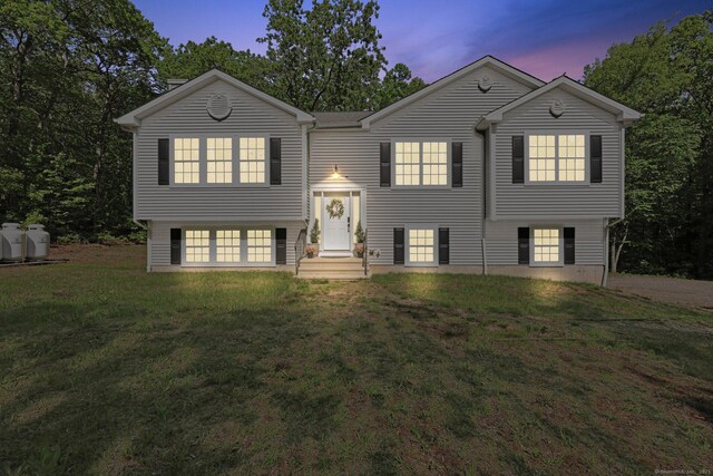 2 Red Fox Run, Wolcott, CT 06716 - split foyer home featuring a lawn, an attached garage, and driveway