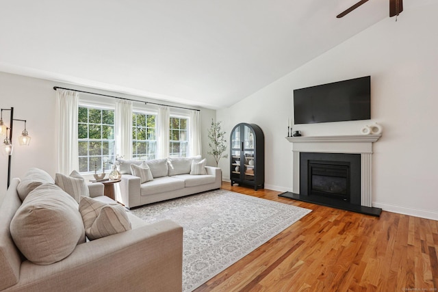 2 Red Fox Run, Wolcott, CT 06716 - living room featuring lofted ceiling, ceiling fan, wood finished floors, a glass covered fireplace, and baseboards