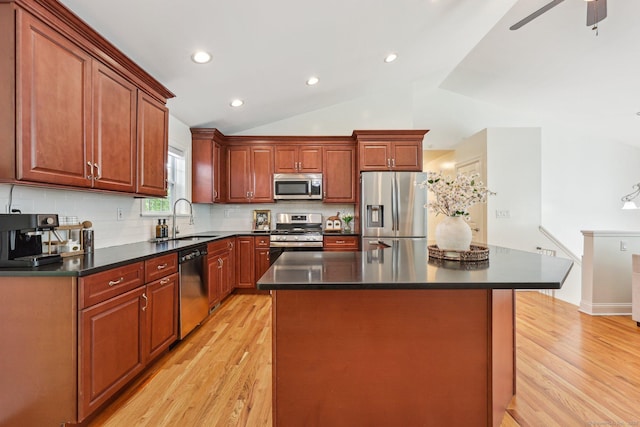 2 Red Fox Run, Wolcott, CT 06716 - kitchen with appliances with stainless steel finishes, a sink, light wood-type flooring, dark countertops, and lofted ceiling