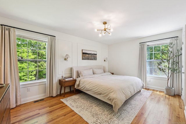 2 Red Fox Run, Wolcott, CT 06716 - bedroom featuring a chandelier, light wood finished floors, and baseboards