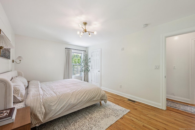 2 Red Fox Run, Wolcott, CT 06716 - bedroom with light wood-style floors, a chandelier, baseboards, and a closet