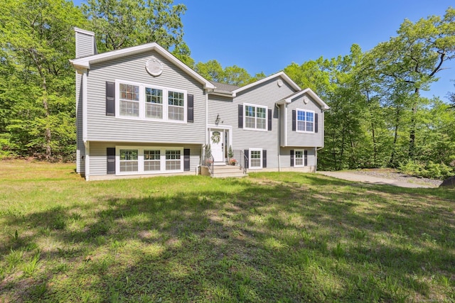 2 Red Fox Run, Wolcott, CT 06716 - bi-level home featuring a chimney and a front yard