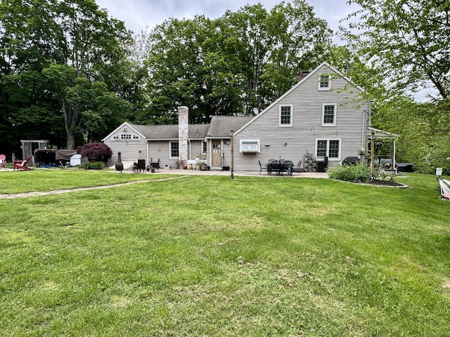 23 Old Mill Rd, Clinton, CT 06413 - back of house featuring a patio, a chimney, a lawn, and view of scattered trees