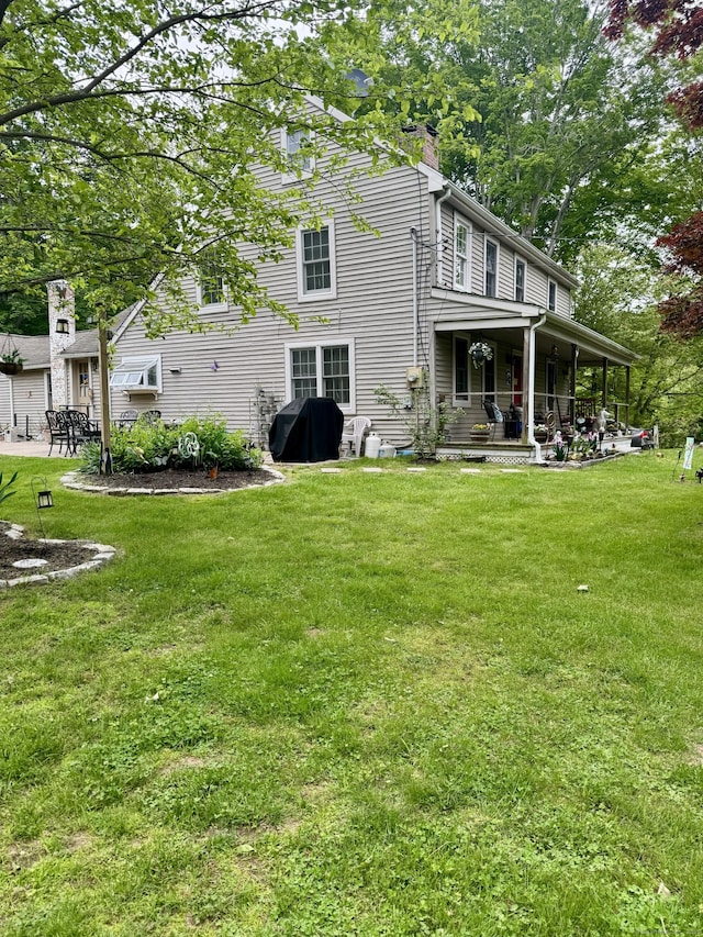23 Old Mill Rd, Clinton, CT 06413 - rear view of house with a lawn, a chimney, and a patio