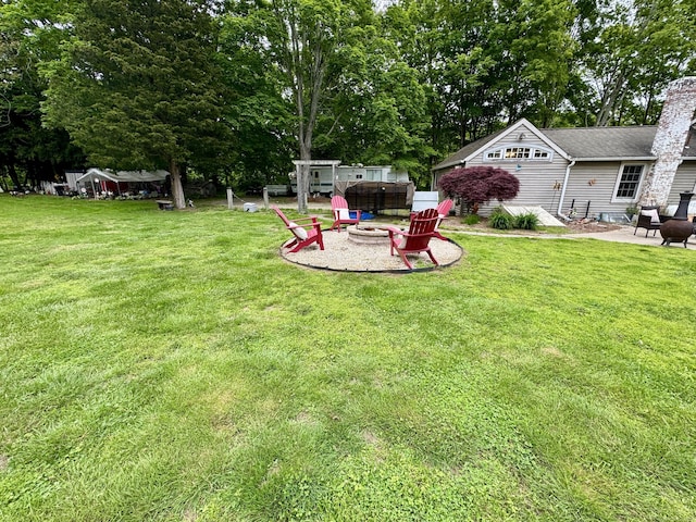 23 Old Mill Rd, Clinton, CT 06413 - view of green lawn featuring a fire pit, a patio, and view of scattered trees