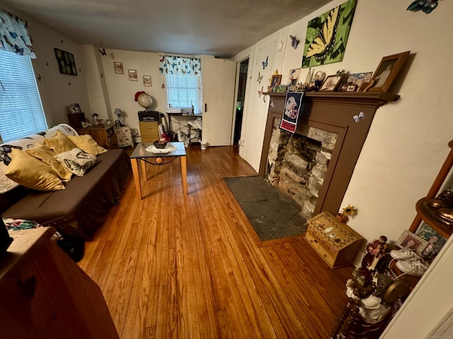23 Old Mill Rd, Clinton, CT 06413 - living area with wood finished floors and a fireplace with flush hearth