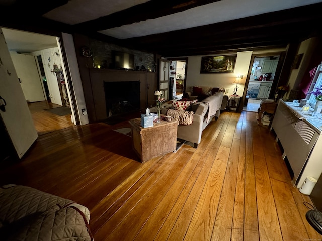 23 Old Mill Rd, Clinton, CT 06413 - living room with hardwood / wood-style flooring, a fireplace with flush hearth, and beam ceiling
