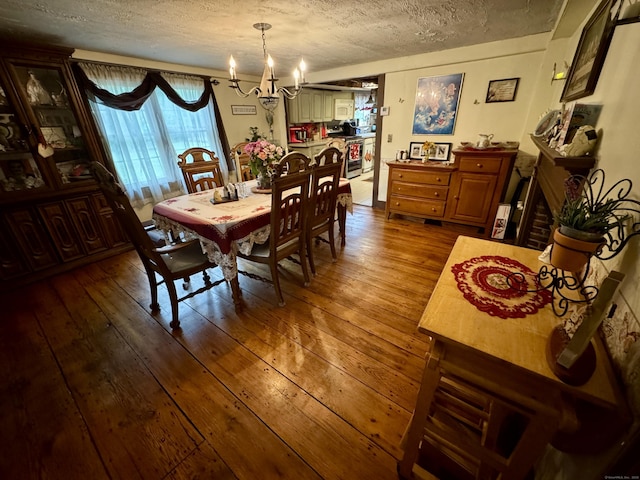 23 Old Mill Rd, Clinton, CT 06413 - dining area featuring a chandelier, a textured ceiling, and dark wood-style flooring