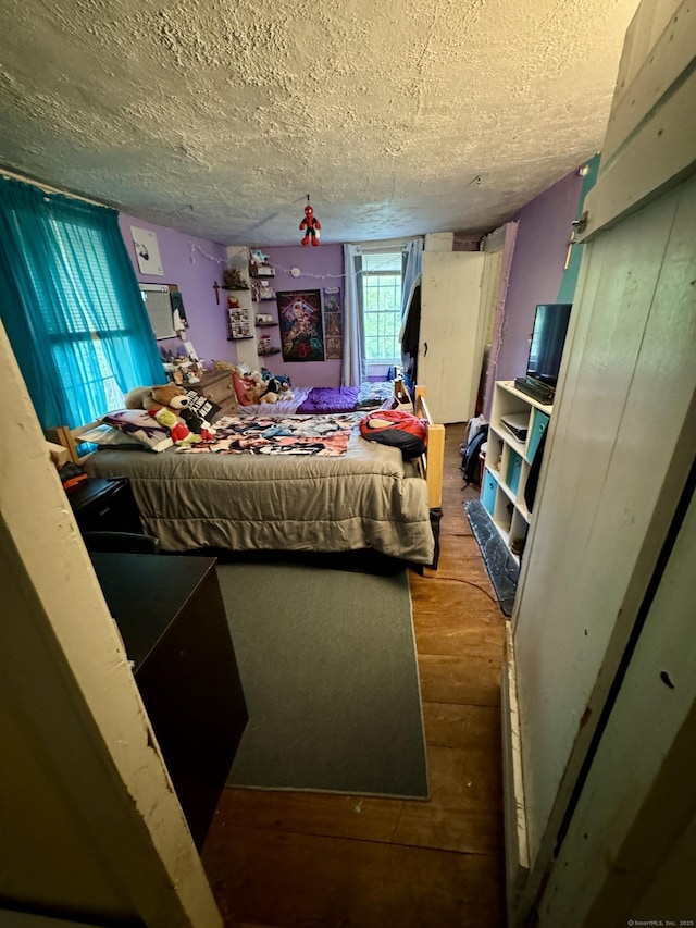 23 Old Mill Rd, Clinton, CT 06413 - bedroom with a textured ceiling and wood finished floors