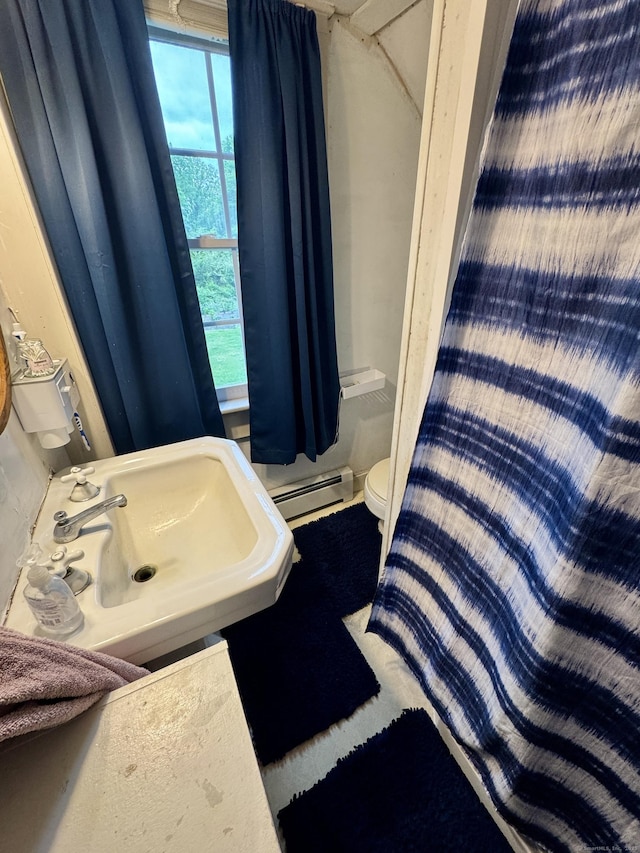 23 Old Mill Rd, Clinton, CT 06413 - bathroom with toilet, baseboard heating, and a sink
