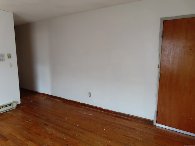 110 Bond St Unit 5B, Hartford, CT 06114 - spare room with hardwood / wood-style flooring and a baseboard heating unit