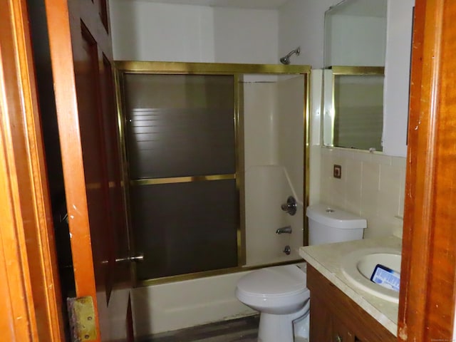 110 Bond St Unit 5B, Hartford, CT 06114 - bathroom with combined bath / shower with glass door, toilet, vanity, and tile walls