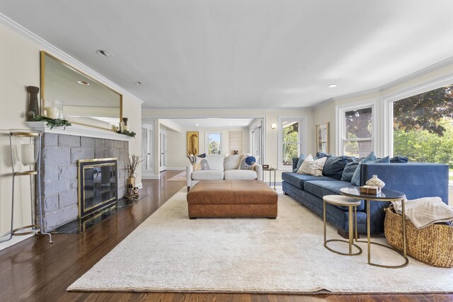 190 Bayview Blvd, Stratford, CT 06615 - living room with ornamental molding, dark wood finished floors, a fireplace with flush hearth, and recessed lighting